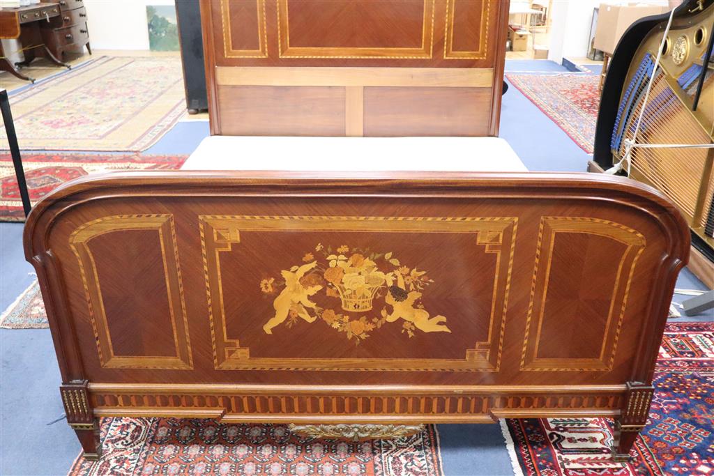 An early 20th century French marquetry inlaid gilt metal mounted bed frame, width 167cm